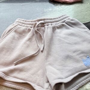 White Fox Boutique Women's Athletic Shorts in grey with light blue logo